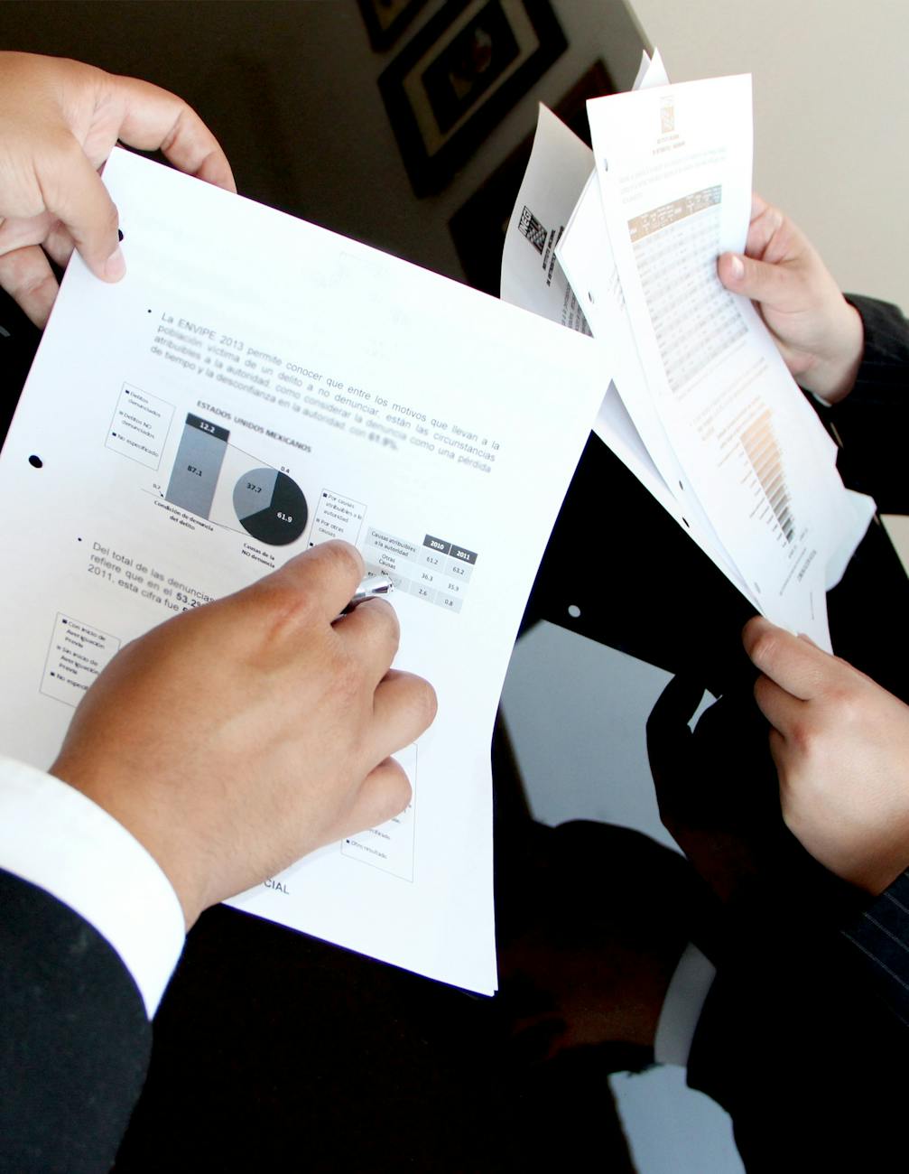 person holding document papers