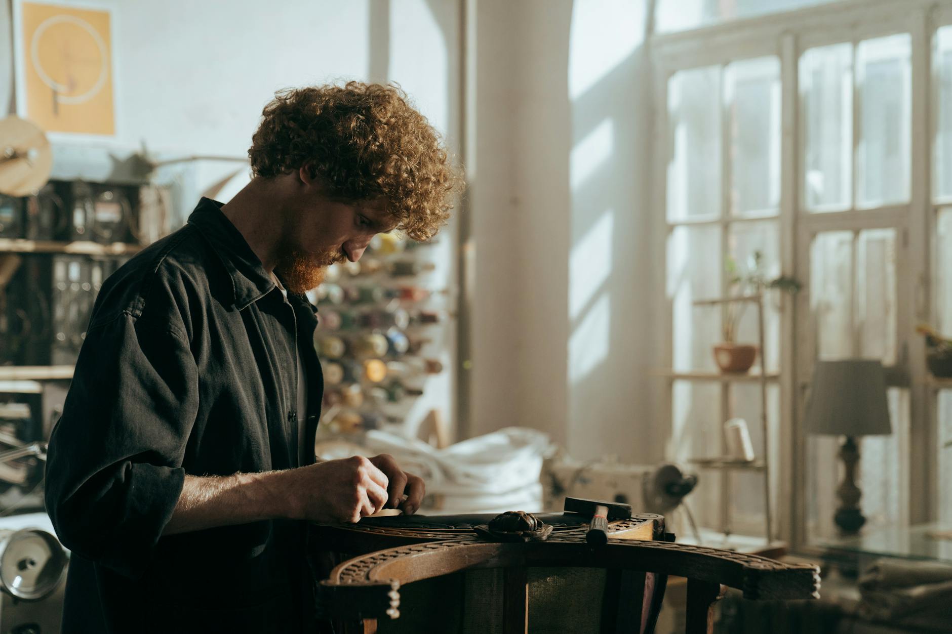 Photo by cottonbro studio on <a href="https://www.pexels.com/photo/man-in-black-polo-shirt-standing-beside-brown-wooden-table-5095283/" rel="nofollow">Pexels.com</a>