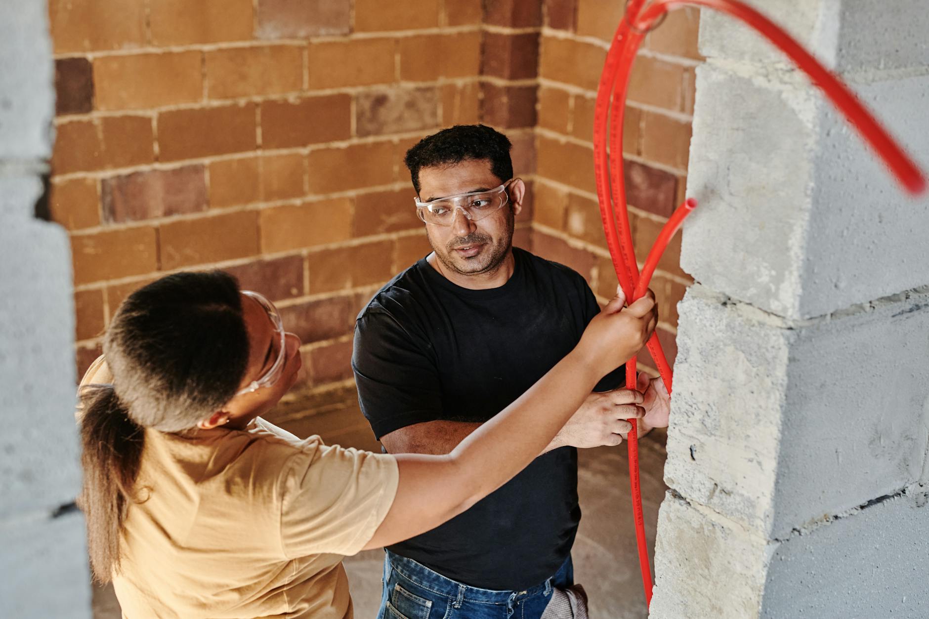 Photo by Mikael Blomkvist on <a href="https://www.pexels.com/photo/man-and-woman-holding-a-red-hose-8961699/" rel="nofollow">Pexels.com</a>